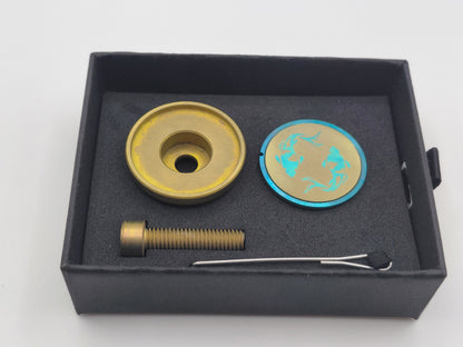 Titanium bicycle stem top cap set in a gift box on a whites background.