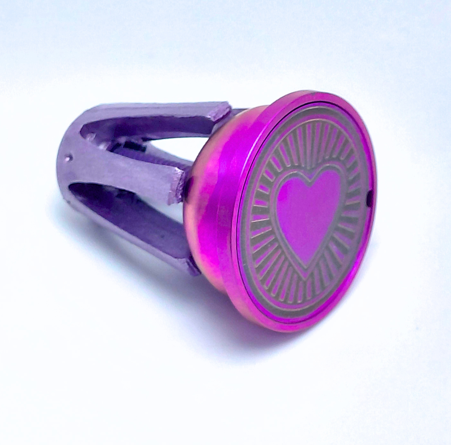 Titanium handlebar End Cap with a heart design on a white background