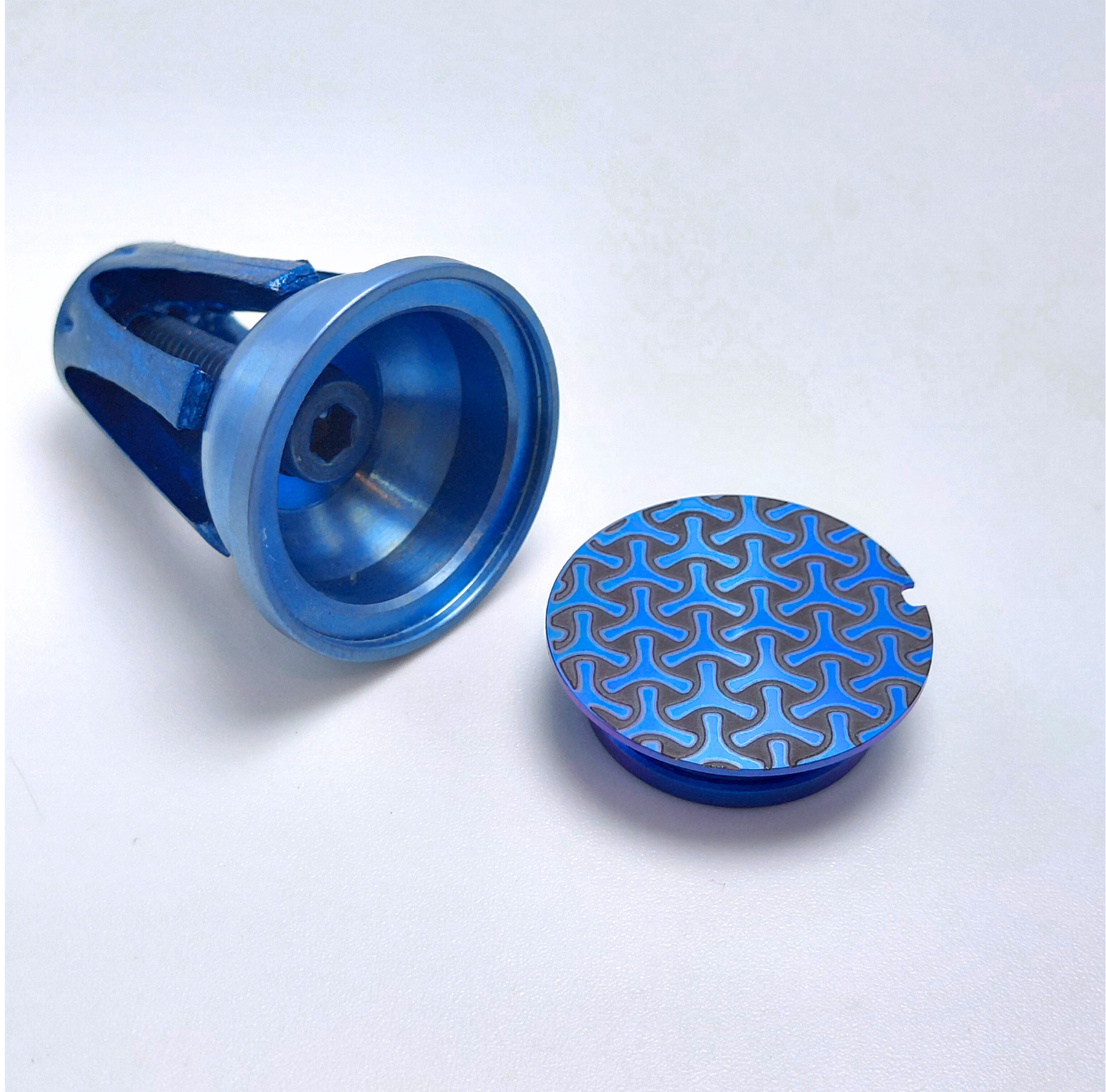 Blue mybikemonogram.com end cap with a textured surface on a white background